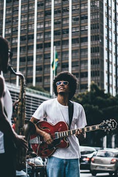 Street musicians playing guitar and saxophone in an urban setting, capturing the vibrant city vibe.